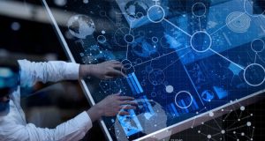 top-view-of-businessman-hand-working-with-modern-technology-and-digital-layer-effect-as-business-strategy-750x400